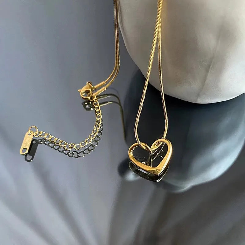 ANENJERY Stainless Steel Twist Hollow Heart Pendant Necklace | Trendy Clavicle Chain for Women